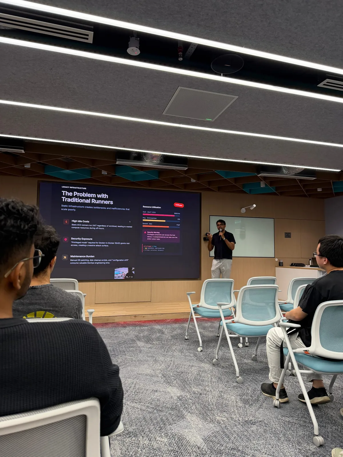 Puvaan Raaj speaking at Docker Kuala Lumpur with slides on traditional runner problems